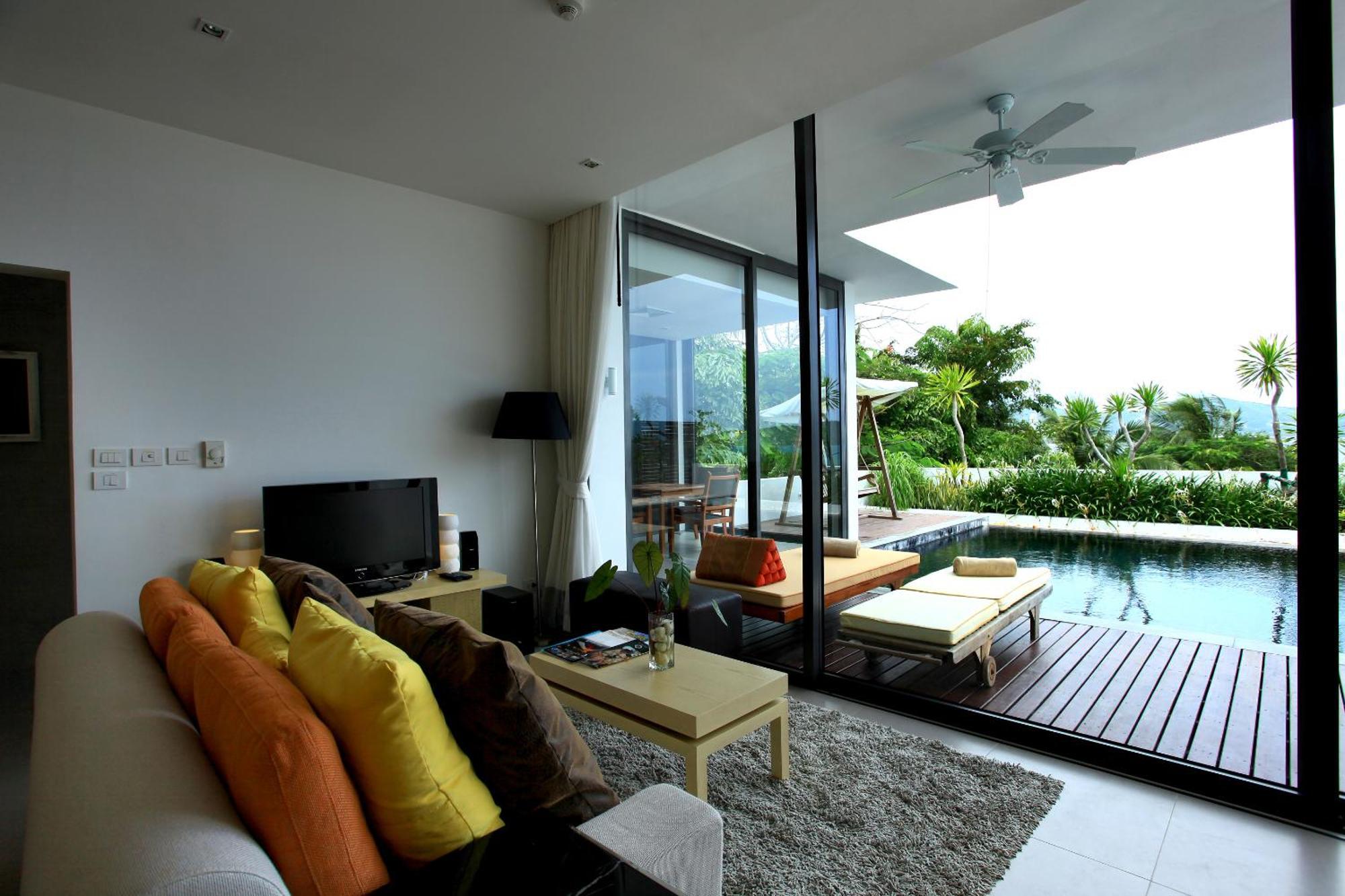 Indochine Resort And Villas - Sha Extra Plus Patong Εξωτερικό φωτογραφία A living room with a view of the pool